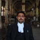 Ashish Mishra, an advocate in Allahabad, moved his chair in front of the pillars of the court after I agreed to click a portrait.